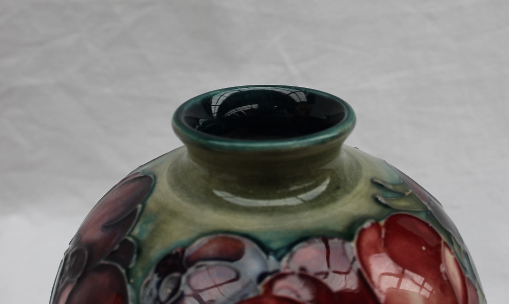 A Moorcroft pottery vase, of globular form decorated in the anemone pattern to a green ground, - Image 2 of 7