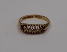 A two stone diamond ring, set with old cut diamonds to an 18ct yellow gold setting and shank,