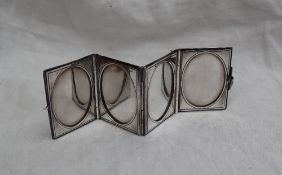 A continental white metal pocket folding photograph frame, of rectangular form,