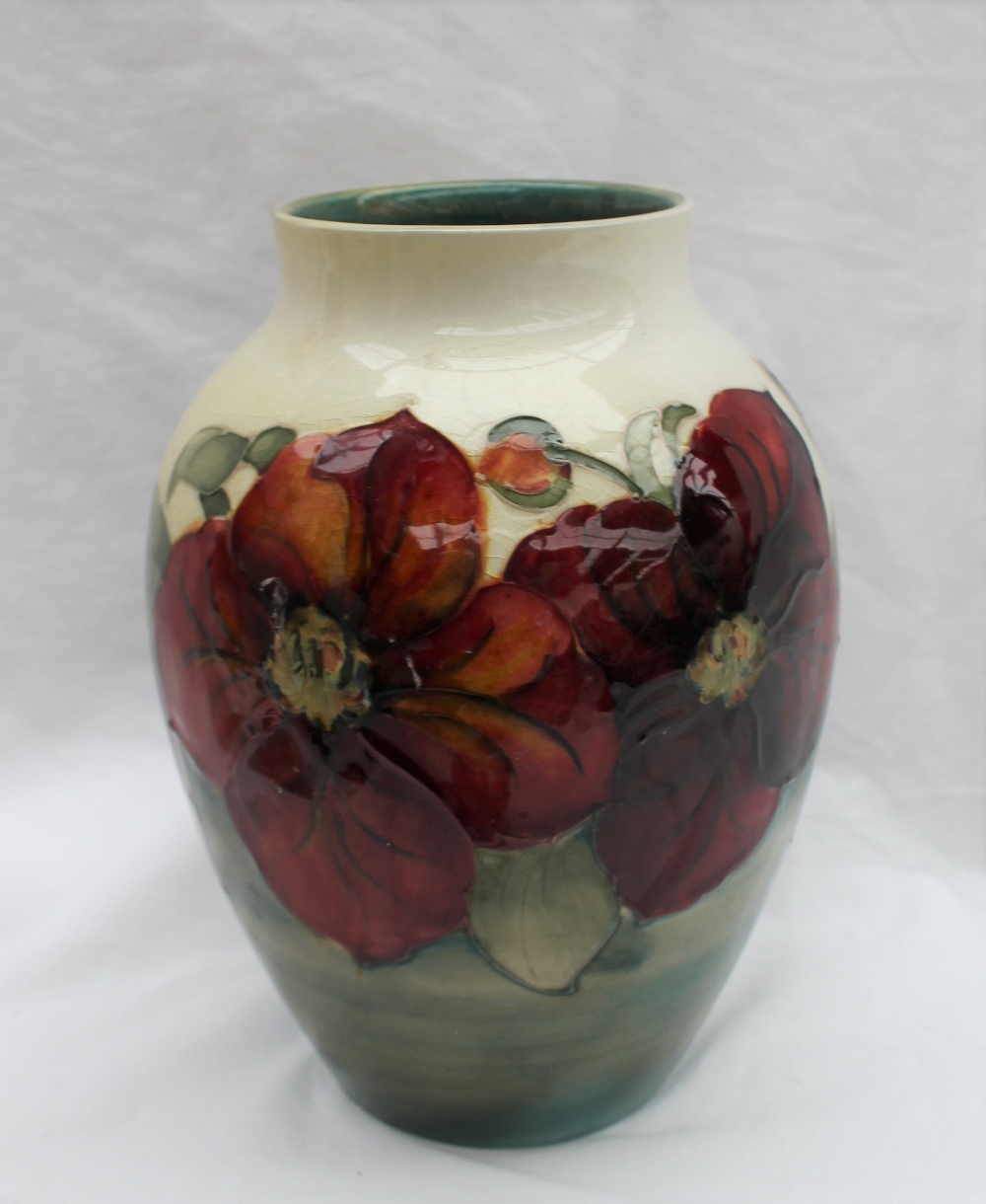 A Moorcroft Clematis pattern vase with a tapering neck to a cream ground, impressed mark, - Image 6 of 7