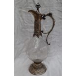 A continental white metal and glass wine ewer,