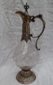 A continental white metal and glass wine ewer,