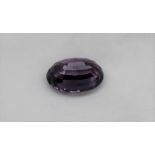 An unmounted amethyst, of oval faceted form, measuring approximately 22mm x 16mm, approximately 4.