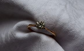 A solitaire diamond ring, the round brilliant cut diamond approximately 0.