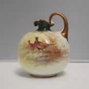 A Doulton Burslem pottery jug, painted with pheasants in a landscape, signed J Wilson Pinxt,