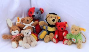 A modern Steiff two tone teddy bear, together with four other Steiff teddy bears,