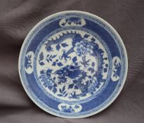 A Japanese blue and white porcelain plate, decorated with a four toed dragon,