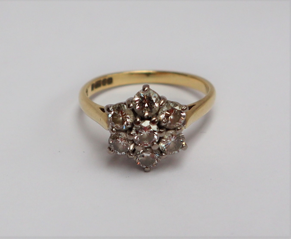 A diamond cluster ring set with seven round brilliant cut diamonds, - Image 3 of 6