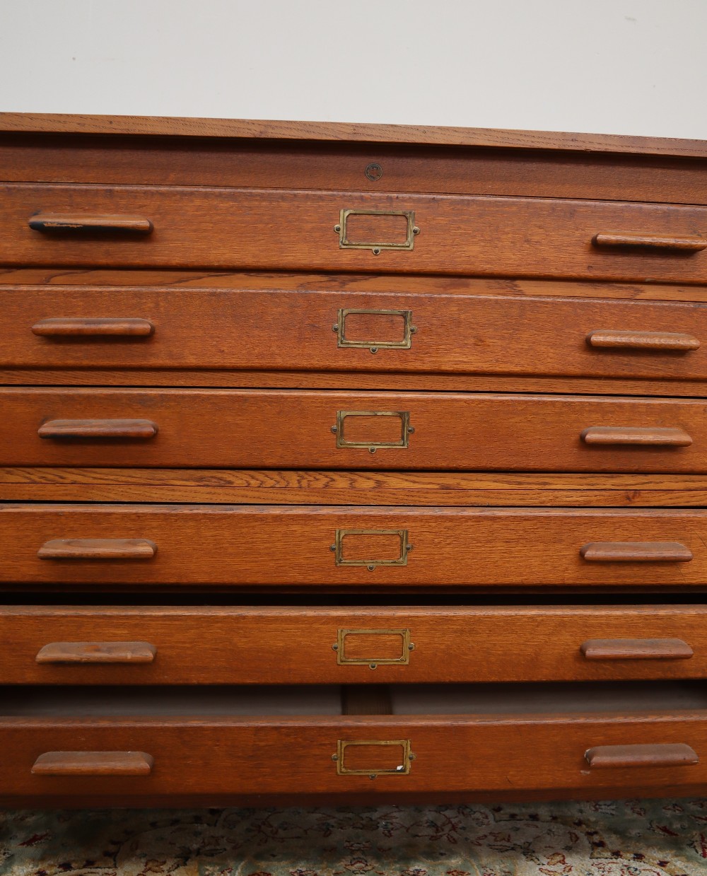 A 20th century oak plan chest, the rectangular top above six drawers on square legs, - Image 5 of 8