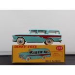 A Dinky Toys diecast model of a Nash Rambler, with a turquoise body, dark red flash,