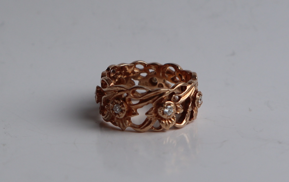 A 14ct yellow gold ring pierced with flowers and leaves set with round brilliant cut diamonds, - Image 5 of 6