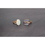 An opal ring, the oval opal 15mm x 11mm to a claw setting on a 22ct gold shank, 6 grams,