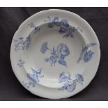 A 19th century porcelain bowl of lobed form, decorated in blue flowers, 25cm diameter,