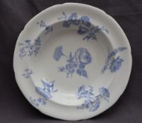 A 19th century porcelain bowl of lobed form, decorated in blue flowers, 25cm diameter,