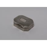 A George V silver pill box, of rectangular form with cut corners,