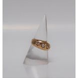 An 18ct yellow gold gypsy ring set with five graduated old round cut diamonds, size K 1/2,