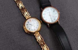 An 18ct yellow gold ladies wristwatch with an enamel dial and Arabic numerals on a 15ct gold sprung