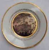 A Swansea porcelain plate painted with a view of Pembroke Castle with a large tree and a figure