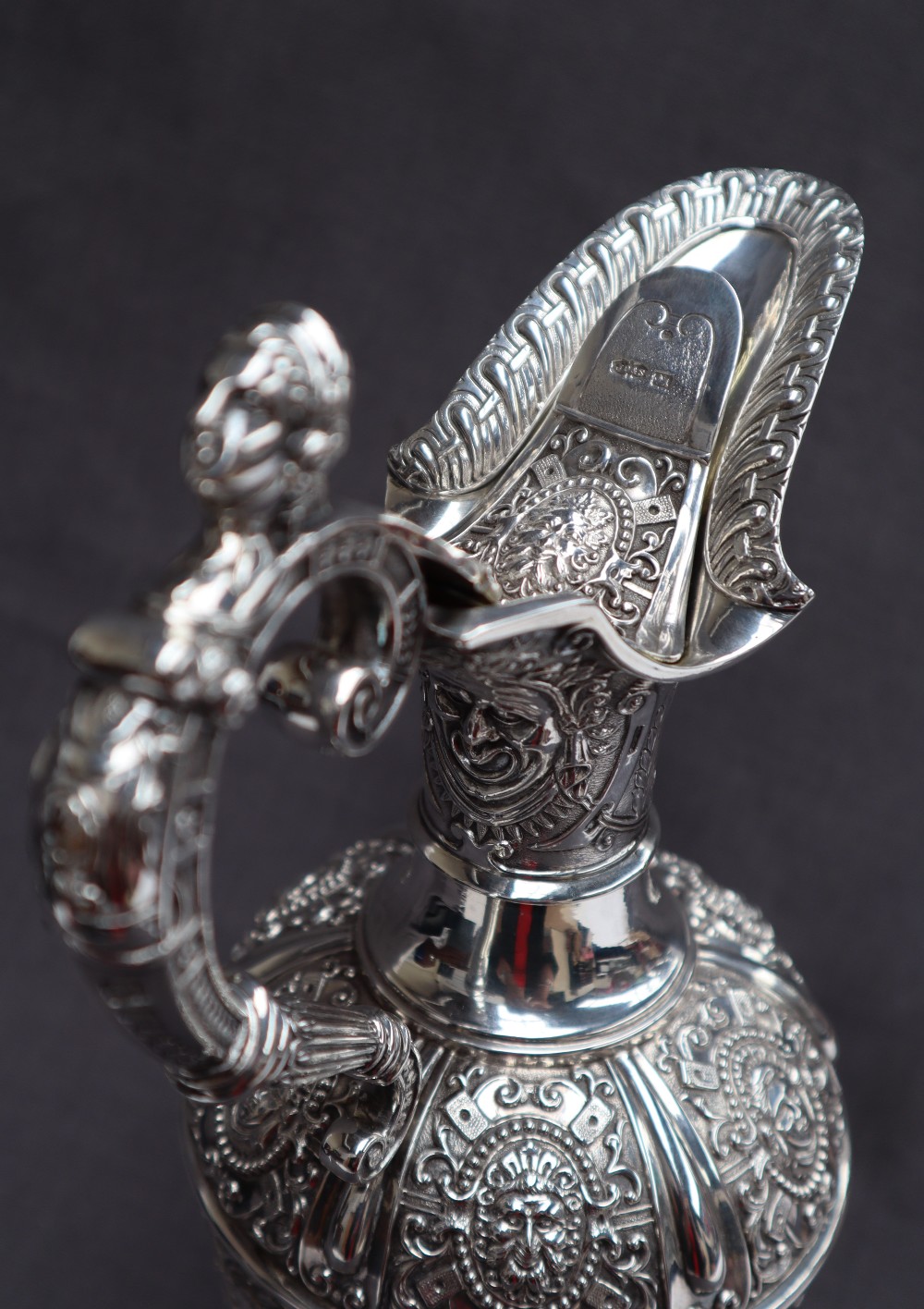 A Victorian silver claret jug, after Cellini, all over decoration of masks and rams, - Image 4 of 13