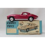 A Corgi Toys diecast model of a Chevrolet Corvette Sting Ray, with a metallic cerise body,