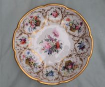 A Nantgarw cruciform bowl, painted with a central bouquet of garden flowers, the heavy gilt rim,