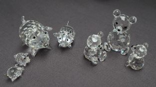 Swarovski crystal -- Four graduated pigs together with three teddy bears