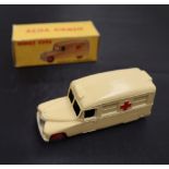 A Dinky Toys diecast model of a Daimler Ambulance, with a cream body, red crosses and red hubs, No.