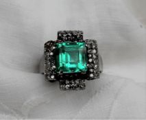 An Emerald and diamond ring,