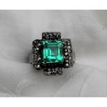 An Emerald and diamond ring,