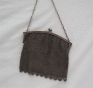 A white metal mesh purse,