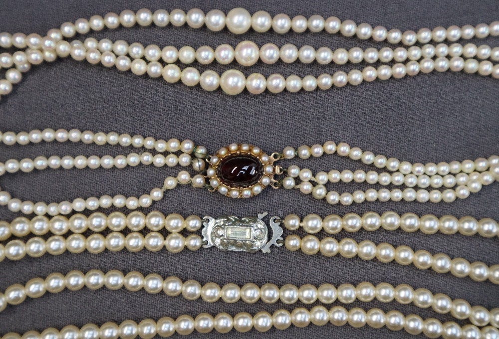 A three strand pearl necklace,