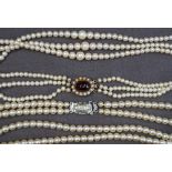 A three strand pearl necklace,