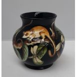 A Moorcroft pottery vase, with a flared rim, decorated in the Kirindi pattern,
