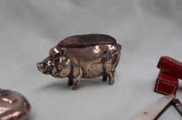 A silver pin cushion in the form of a pig, Birmingham, Henry Matthews, date letter rubbed,