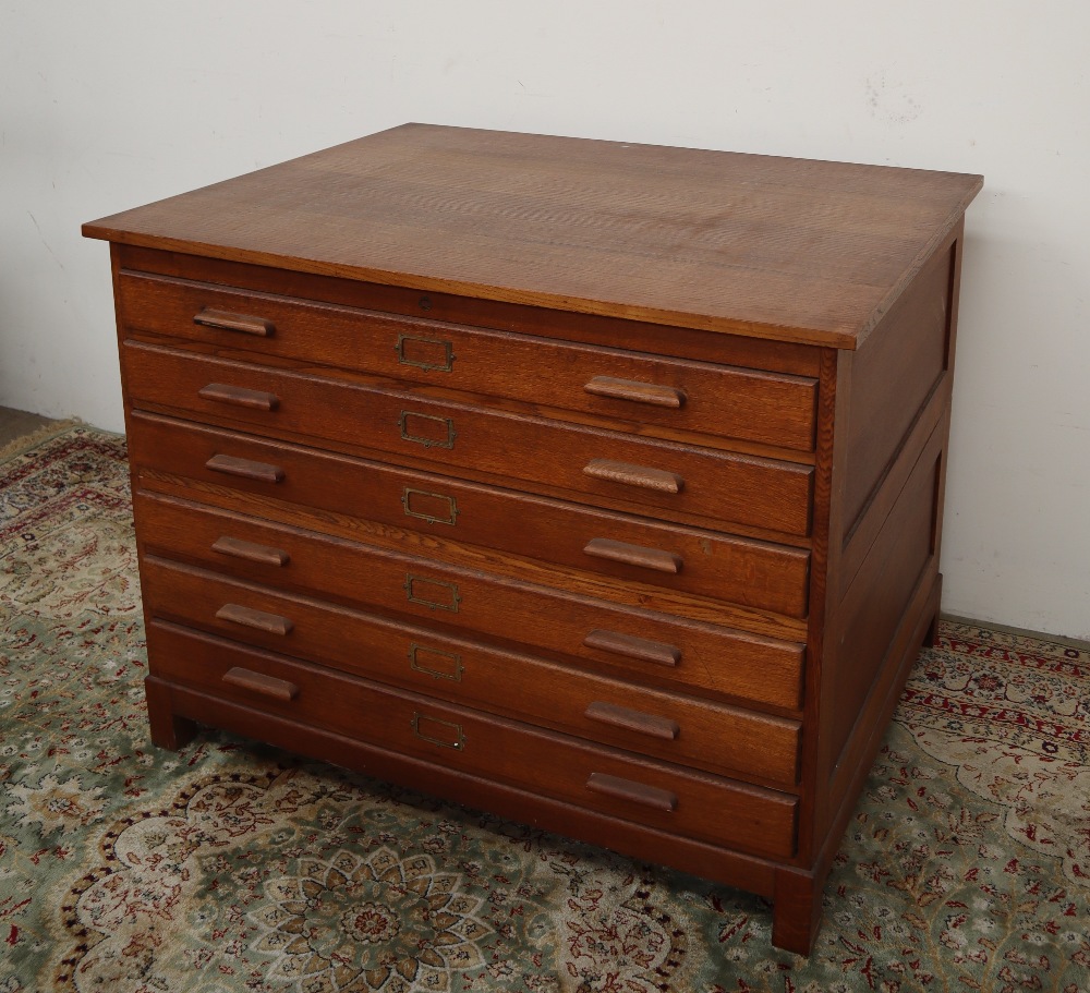 A 20th century oak plan chest, the rectangular top above six drawers on square legs, - Image 2 of 8