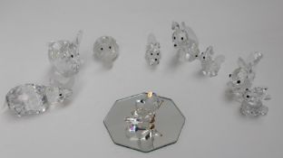 Swarovski crystal -- Three foxes together with a rhinoceros, snail,