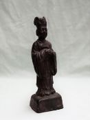 A Chinese bronze figure of a dignitary with a hat, robe and clasped hands on a square base, 19.