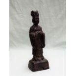 A Chinese bronze figure of a dignitary with a hat, robe and clasped hands on a square base, 19.