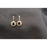 A pair of 18ct yellow gold ruby and diamond drop earrings,