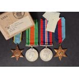 Four World War II medals comprising The British War Medal, The Defence Medal,