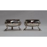 A pair of George III silver cauldron table salts, with a flared rim on cabriole legs,
