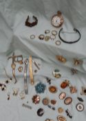 Assorted costume jewellery including an open faced pocket watch, brooches,