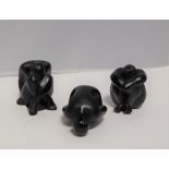 A set of three black satin Lalique figures of nudes in various positions, script mark,