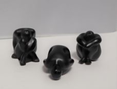 A set of three black satin Lalique figures of nudes in various positions, script mark,