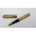 A Waterman self filling gilt metal fountain pen, with suspension ring,