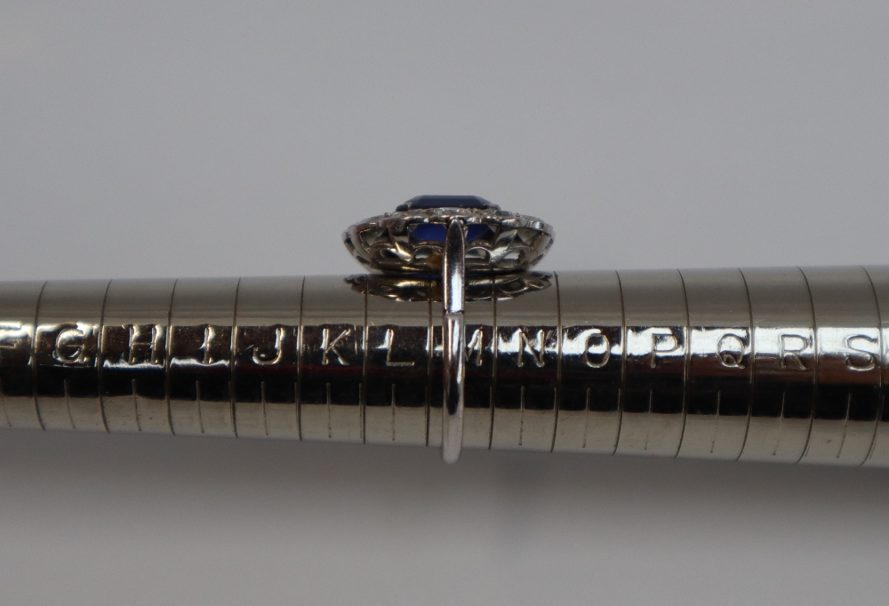 A sapphire and diamond cluster ring, the emerald cut sapphire approximately 11mm x 8mm, - Image 6 of 6