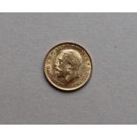 A George V gold half sovereign,