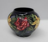 A Nicola Slaney for Moorcroft pottery vase, decorated in the Diamond Jubilee pattern, dated 2011,