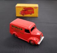 A Dinky Toys diecast model of a Trojan 15 CWT Van "Dunlop", with a red body and red hubs, No.