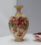 A Royal Worcester porcelain single stem vase, decorated with flowers and leaves to an ivory ground,